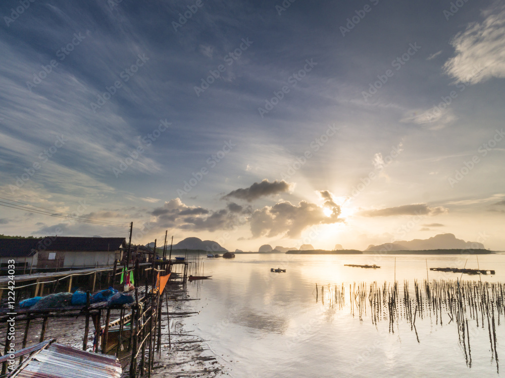 Fishing village and sunrise at Samchong-tai, Phangnga, Thailand.
