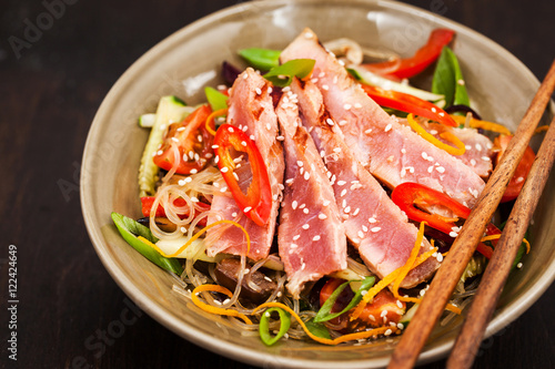 Grilled tuna and  asian rice glass noodles with vegetables