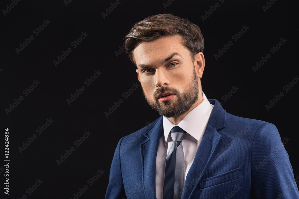 Confident businessman expressing his seriousness Confident businessman expressing his seriousness