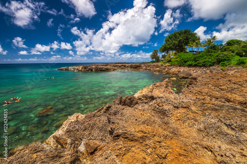 Scenic landscape of Sharks Cove, Hawaii, a small rocky bay side of Pupukea Beach Park. Sharks Cove is the second best snorkeling site on Oahu, North Shore, and boasts an impressive amount of sea life. photo