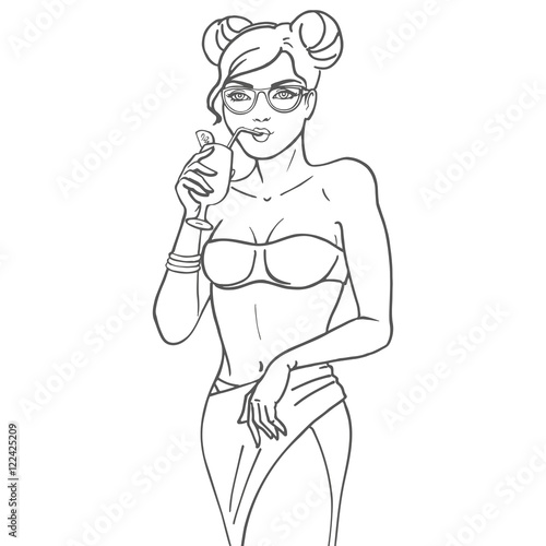 Girl drink juice through a straw from a glass