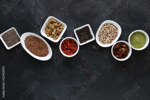 Super Food in bowls on dark ground