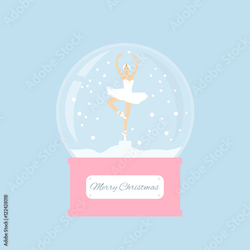 Merry christmas glass ball with a ballerina dancing in the snow. 