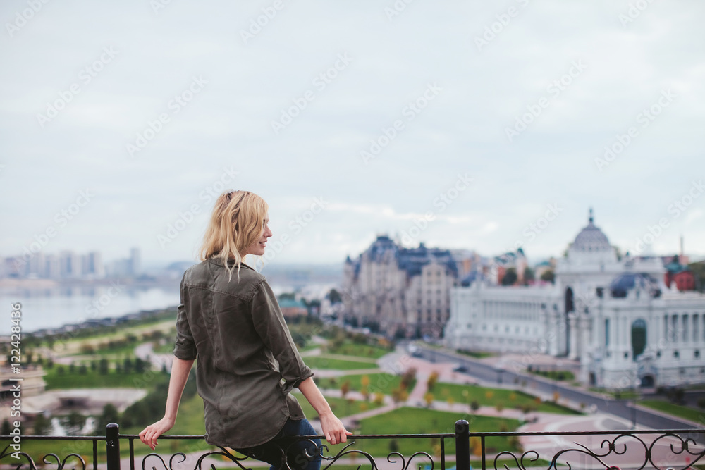 woman sitting on the viewing platform overlooking the city of Kazan