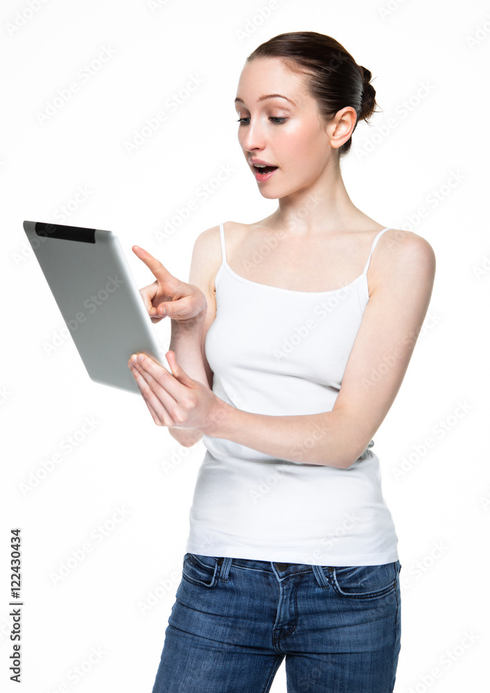 Beautiful woman browsing internet on tablet Beautiful woman browsing internet on tablet