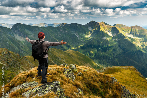 Photos Hiker with backpack on mountains