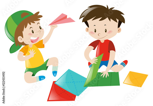 Two boys folding paper airplane