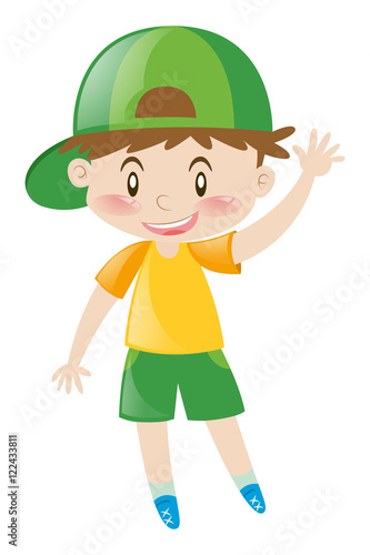 Little boy with green hat waving