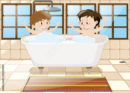 Two boys taking bath together in tub