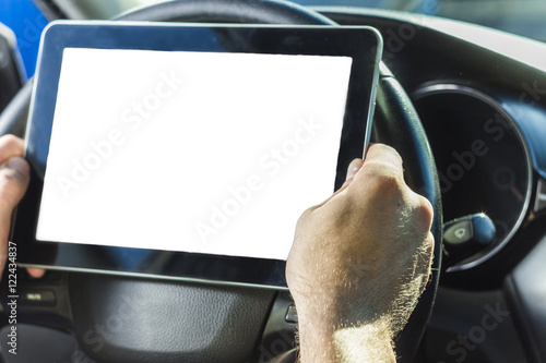 The man in the car, with the Tablet in hands photo