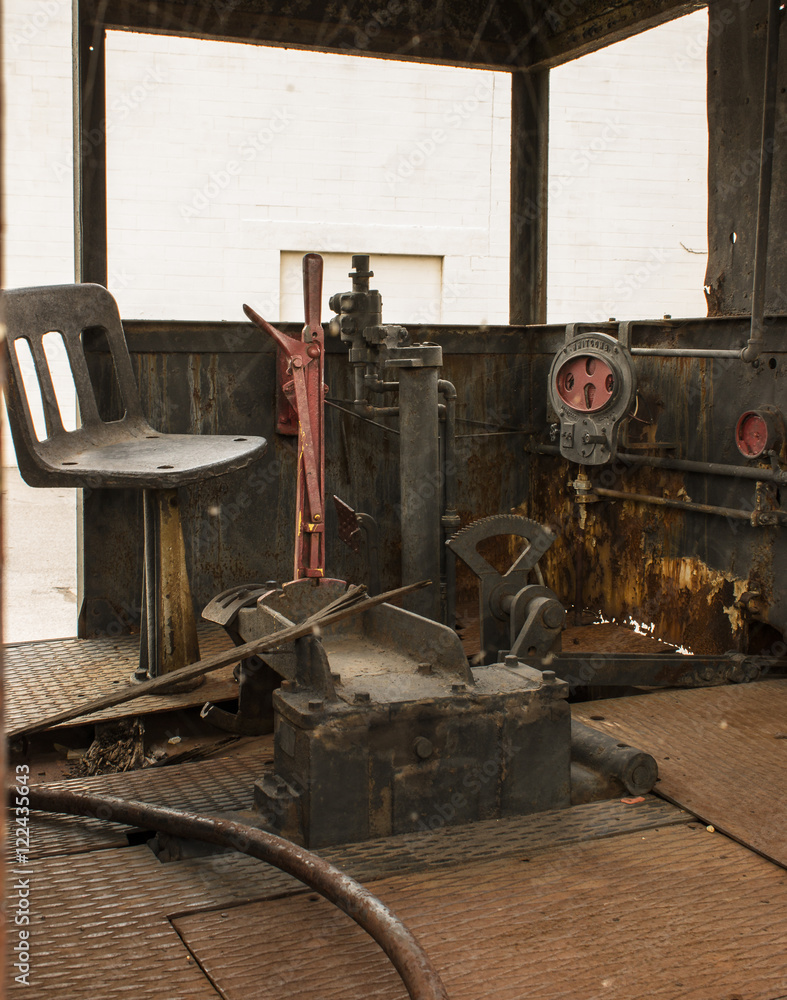 Old steam locomotive cab interior with red and rust