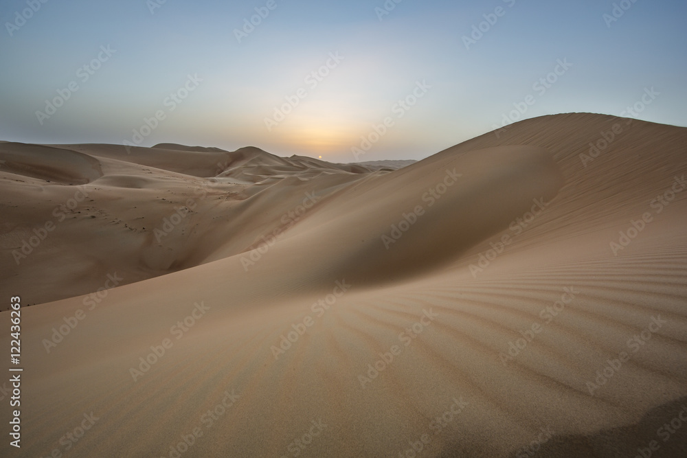 sunset over sand dunes of Empty Quarter desert