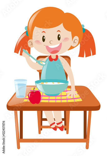 Girl on dining table eating
