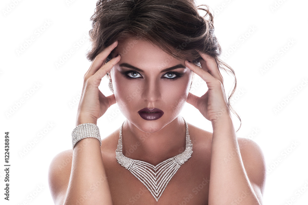 Gorgeous woman is wearing beautiful jewellery Gorgeous woman is wearing beautiful jewellery
