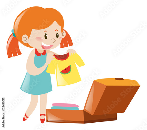 Little girl packing suitcase