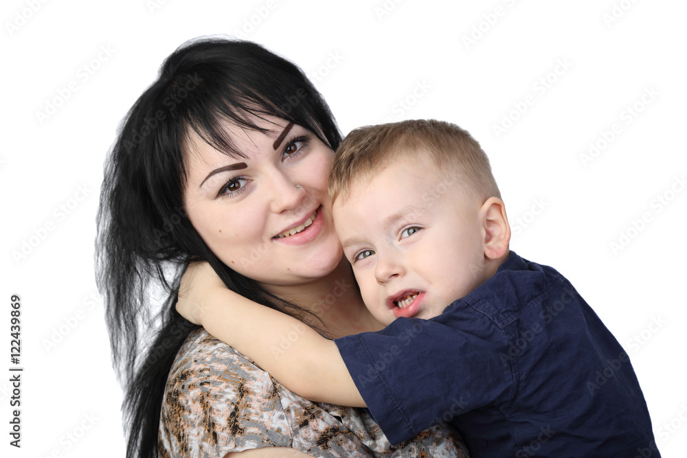Motherhood and son's love - Little boy embraces black haired woman isolated on white background Motherhood and son's love - Little boy embraces black haired woman isolated on white background