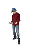 Teenage boy in blue hat,  red shirt, jeans and sneakers stands in aggressive pose full height isolated on white background