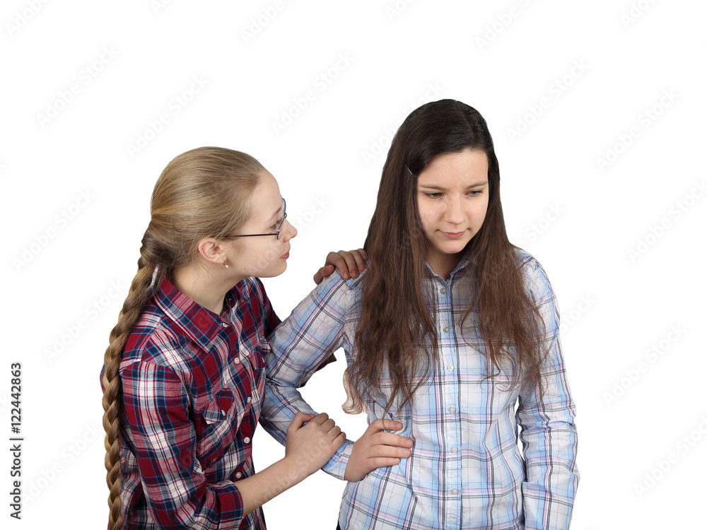 Teenage girl comforts girlfriend isolated on white background - friendship, sympathy and compassion concept Teenage girl comforts girlfriend isolated on white background - friendship, sympathy and compassion concept