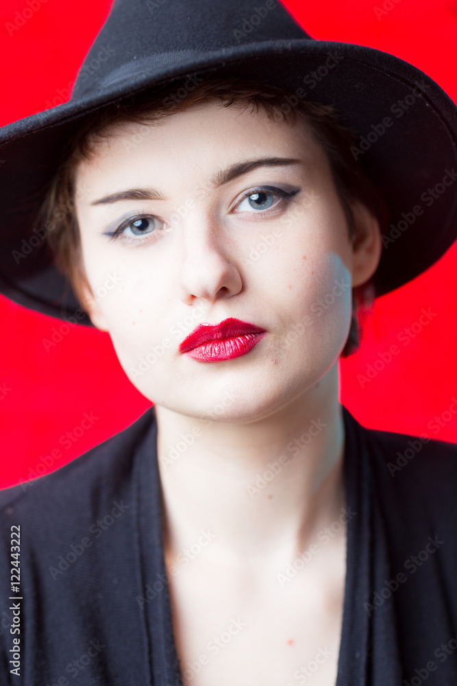 Studio portrait in front of red background of woman Studio portrait in front of red background of woman