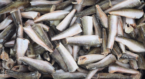 Frozen tadpole codling fish on a fish market, view from top, fits as background photo