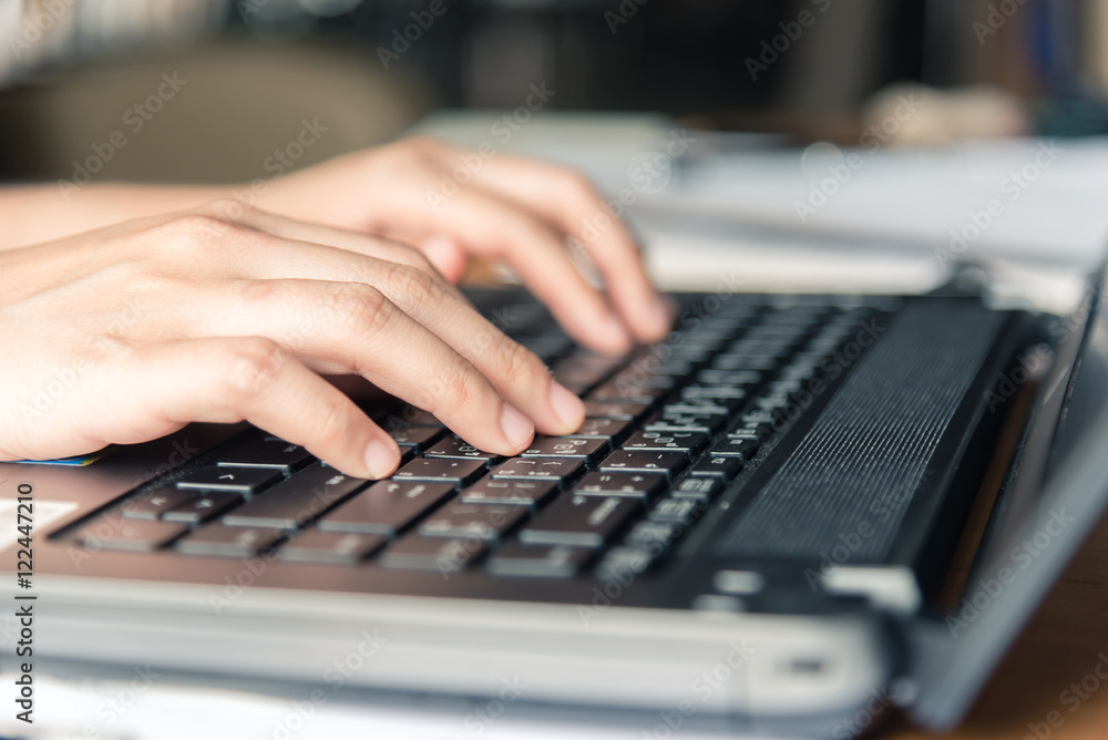 Female hand using keyboard on computer laptop. Female hand using keyboard on computer laptop.