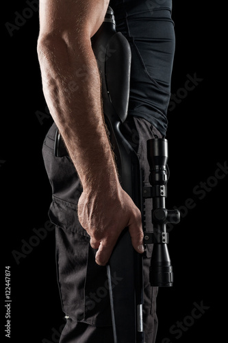 Soldier with sniper rifle isolated on black background