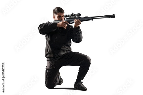 Fototapeta Soldier with sniper rifle aiming isolated on white