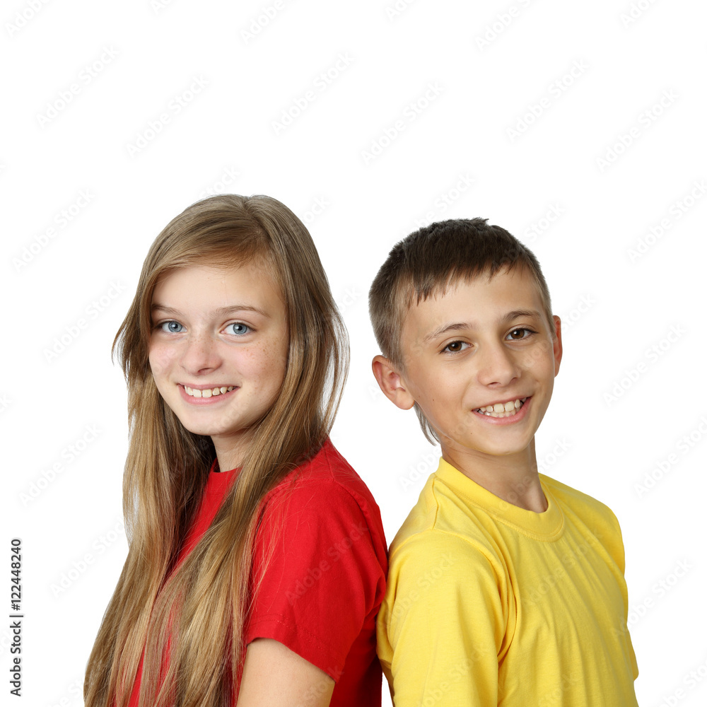 Happy together - teenage boy and girl in yellow and red t-shirts back to back looking forward with smiles isolated on white background in square Happy together - teenage boy and girl in yellow and red t-shirts back to back looking forward with smiles isolated on white background in square