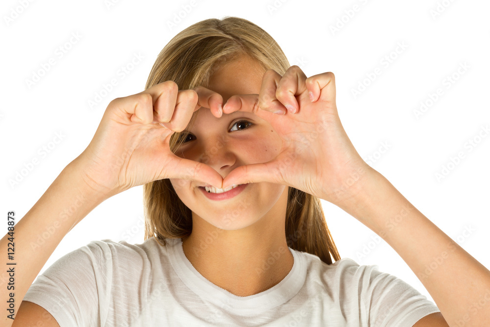 Young girl forming heart symbol with her hands over white background Young girl forming heart symbol with her hands over white background