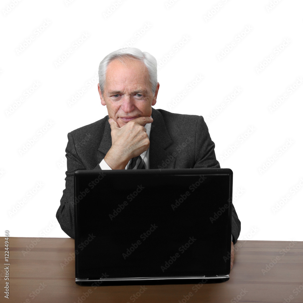 Senior man sits and thoughtfully looks at notebook isolated on white background Senior man sits and thoughtfully looks at notebook isolated on white background