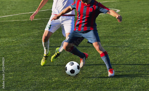  playing football soccer game on sports field © Vitaly Krivosheev