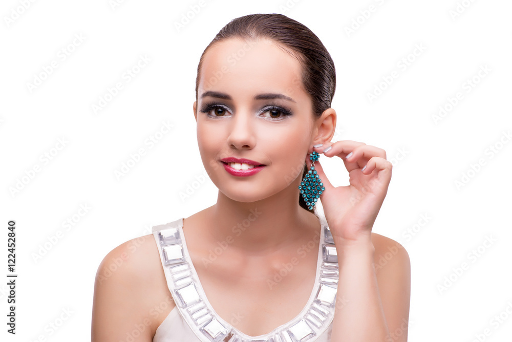 Young woman showing off her jewellery isolated on white