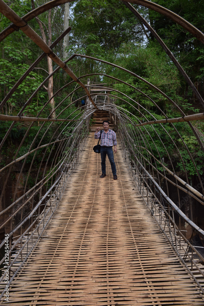 Abstract soft blurred and soft focus the man standing on a bamboo wickerwork bridge. Abstract soft blurred and soft focus the man standing on a bamboo wickerwork bridge.