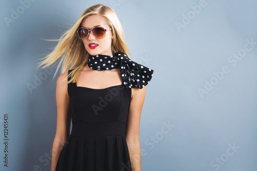 Beautiful blonde woman in a black dress
