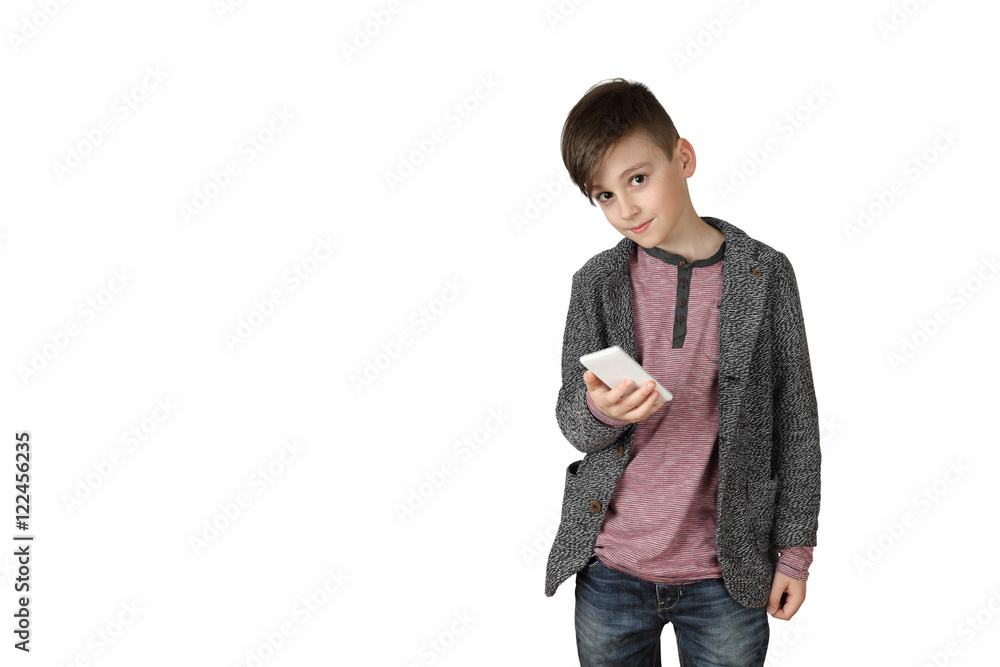 Teenage boy holds cell phone in hand isolated on white background with copy space for text Teenage boy holds cell phone in hand isolated on white background with copy space for text