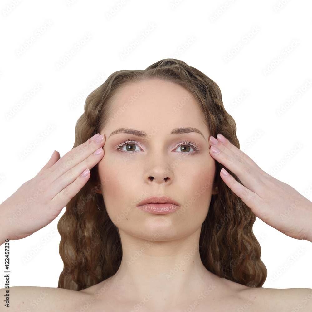 Fototapeta premium Beauty, makeup, skin care concept - Young pretty woman makes facial massage isolated on white background