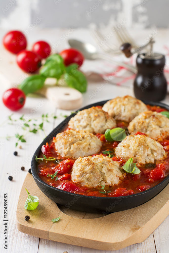 Meatballs with rice in tomato sauce on a light background. Selective focus. Meatballs with rice in tomato sauce on a light background. Selective focus.