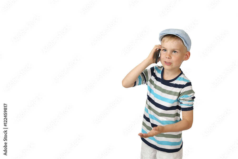 Boy speaks by cell phone isolated on white background with copy space for text or advertising Boy speaks by cell phone isolated on white background with copy space for text or advertising