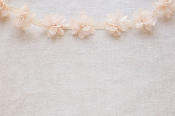 Flowers and lace on linen, copy space vintage wedding background