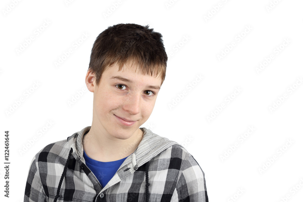 Attractive smiling teenage boy portrait isolated on white background with copy space for text message Attractive smiling teenage boy portrait isolated on white background with copy space for text message