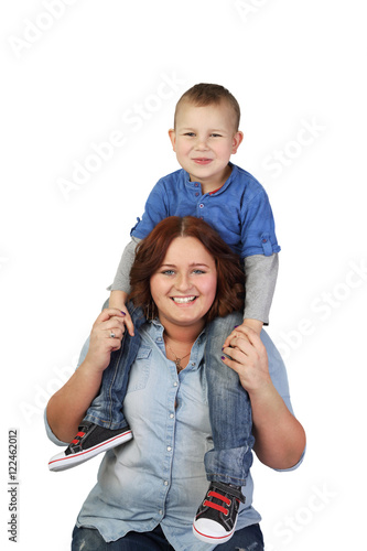 Plump woman holds boy on shoulders isolated on white background - Mother with little son - Happy childhood