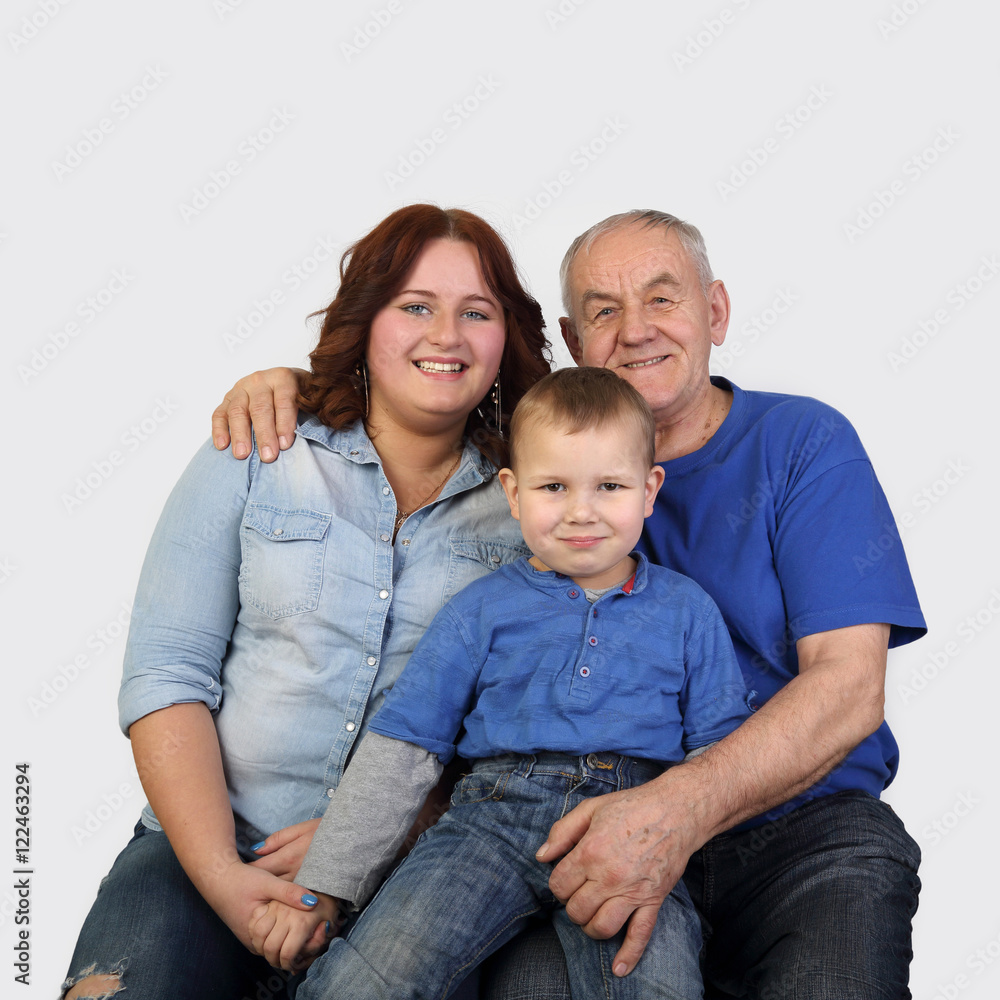 Old man, woman and little boy - Three generations of one family - Grandfather, mother and son portrait on gray background in square Old man, woman and little boy - Three generations of one family - Grandfather, mother and son portrait on gray background in square