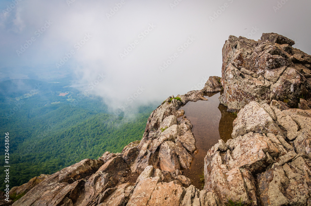 Water puddle on Little Stony Man Cliffs and foggy view of the Bl