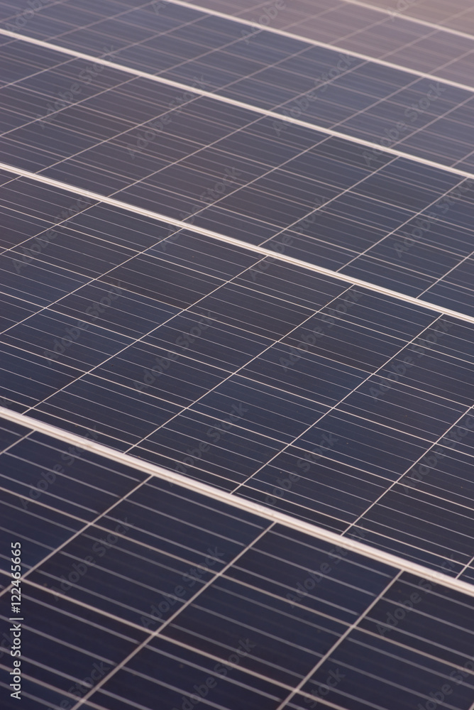 Vertical array of large, thin film photovoltaic solar panels. Alternative energy and technology concept. Vertical array of large, thin film photovoltaic solar panels. Alternative energy and technology concept.
