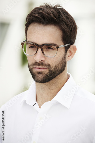 Fototapeta Naklejka Na Ścianę i Meble -  Serious man wearing spectacles