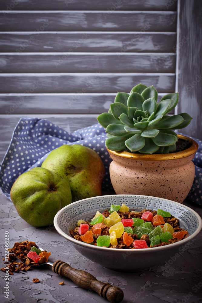 Granola with candied fruit, pears and succulent Granola with candied fruit, pears and succulent