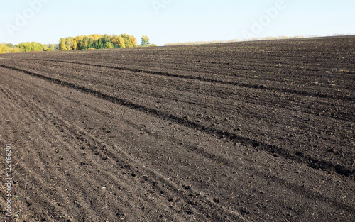 Farmland with large agricultural plowed field