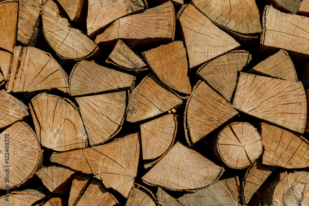 Fototapeta premium Background of firewood harvested for the new heating season.