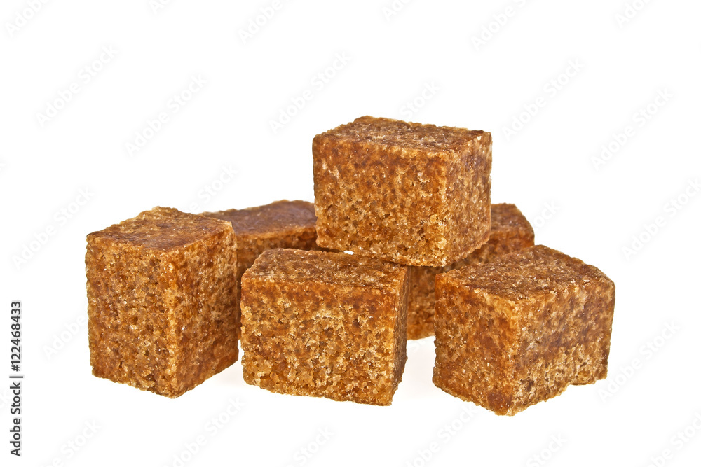 Brown sugar cubes isolated on a white background Brown sugar cubes isolated on a white background