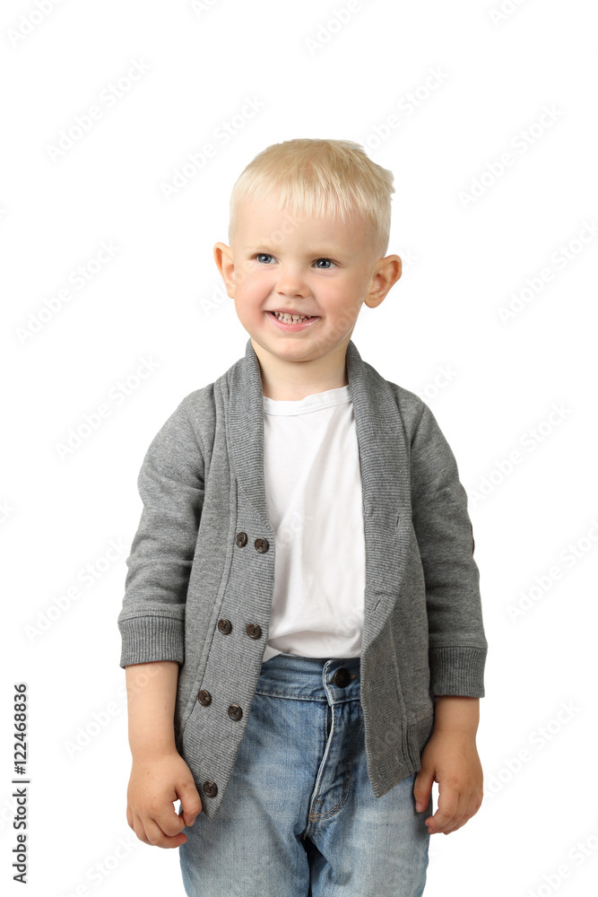 Cute little blond boy stands smiling isolated on white background Cute little blond boy stands smiling isolated on white background